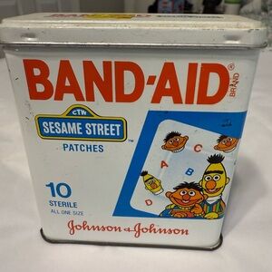 Vintage bandaid patches tin can Sesame Street empty tin